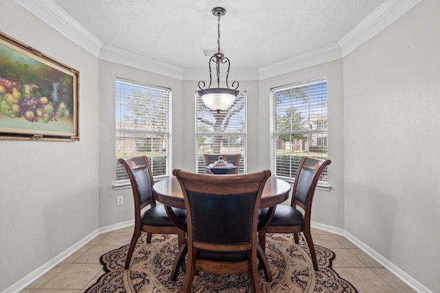 dining room featuring ornamental molding, plenty of natural light, and light tile patterned floors