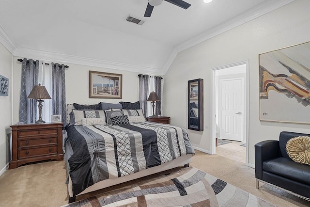 carpeted bedroom with vaulted ceiling, crown molding, and ceiling fan