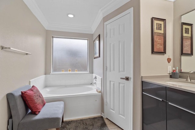 bathroom with tile patterned floors, ornamental molding, vanity, and a washtub