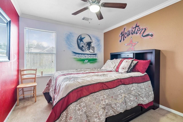 carpeted bedroom featuring ceiling fan and ornamental molding