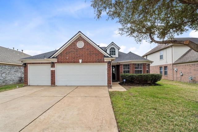 front of property featuring a front lawn and a garage