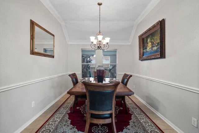 tiled dining space with a notable chandelier, ornamental molding, and lofted ceiling