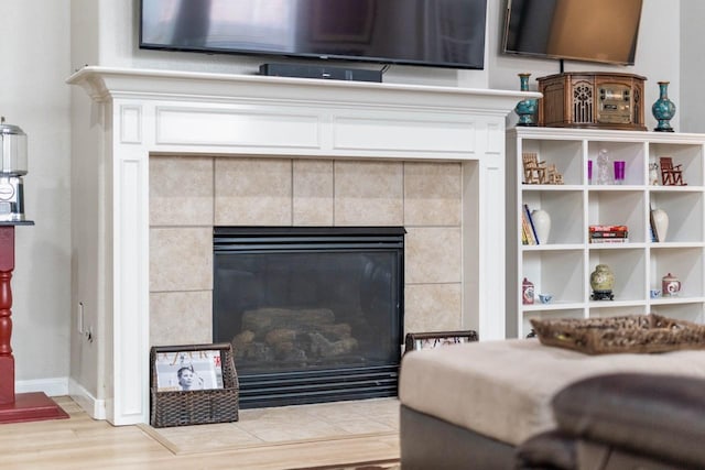 room details featuring hardwood / wood-style floors and a fireplace