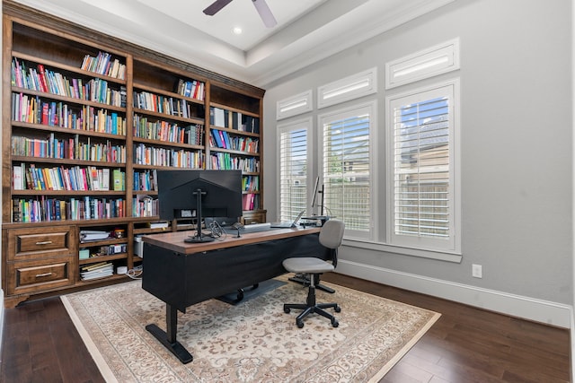 home office with dark wood-type flooring and ceiling fan