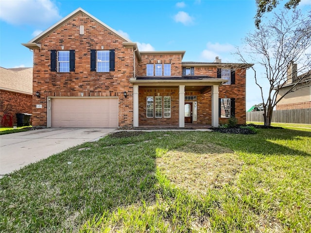 traditional home featuring driveway, a front lawn, and brick siding