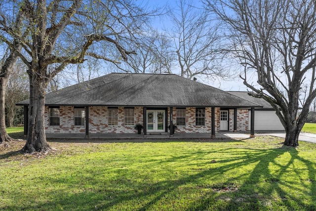 ranch-style house featuring a front yard and french doors