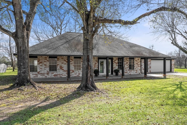 single story home featuring a garage and a front lawn