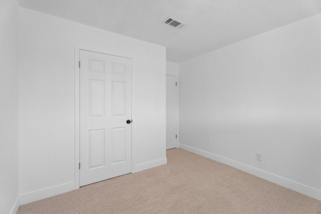 unfurnished bedroom with light carpet