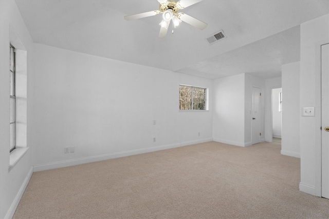 carpeted empty room featuring ceiling fan