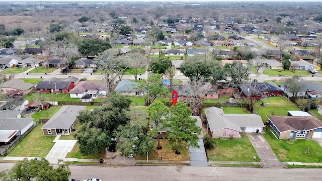 birds eye view of property with a residential view