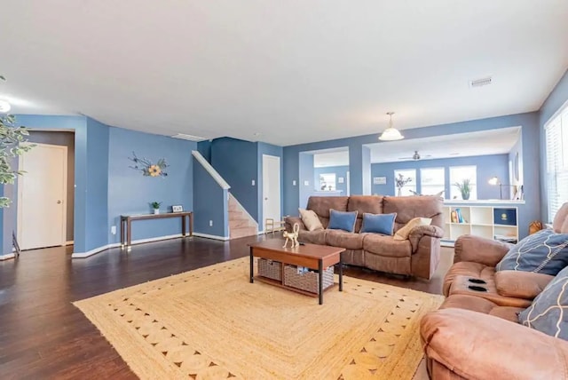 living room with dark hardwood / wood-style flooring