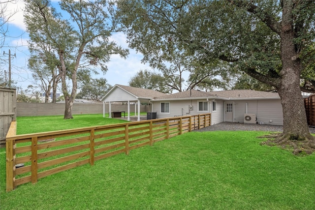 back of property featuring a lawn