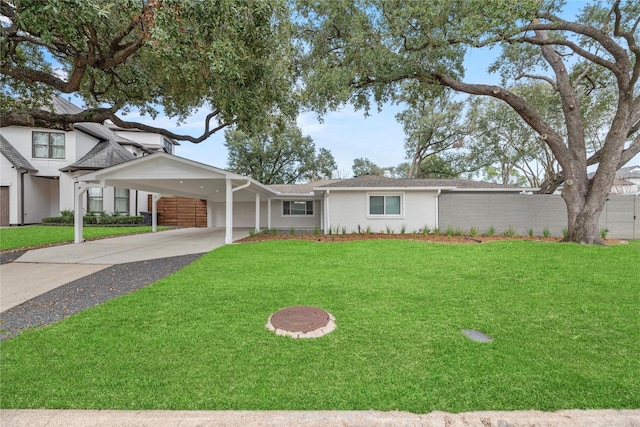 ranch-style home with a carport and a front lawn