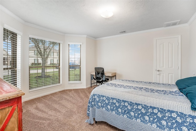 bedroom with a textured ceiling, ornamental molding, and carpet flooring