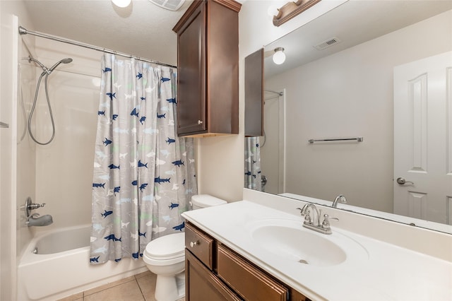 full bathroom featuring vanity, shower / bath combo, toilet, and tile patterned floors