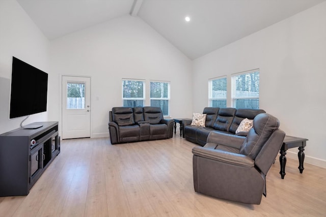 living room featuring high vaulted ceiling, beamed ceiling, and light wood-type flooring