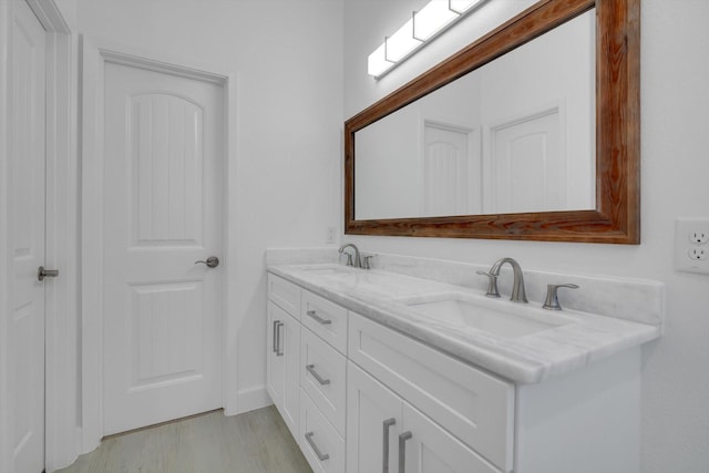 bathroom featuring vanity and hardwood / wood-style floors