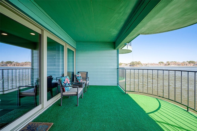 balcony featuring a water view