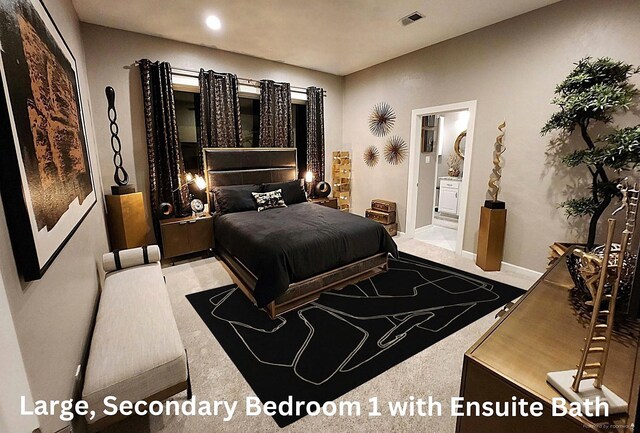 bedroom featuring visible vents and ensuite bathroom