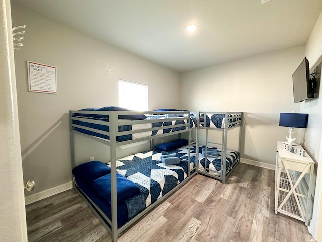 bedroom featuring wood-type flooring