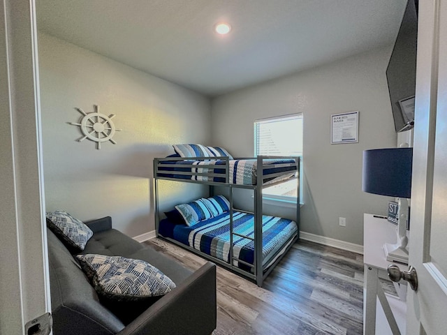 bedroom featuring wood-type flooring