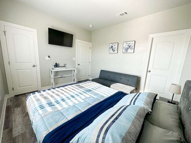 bedroom featuring dark hardwood / wood-style floors