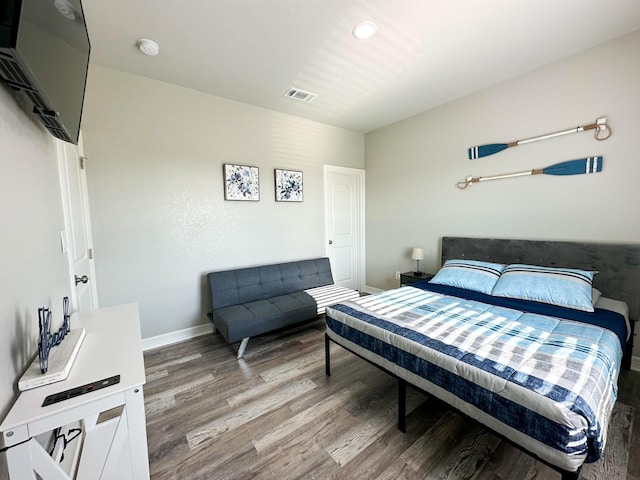 bedroom featuring hardwood / wood-style floors