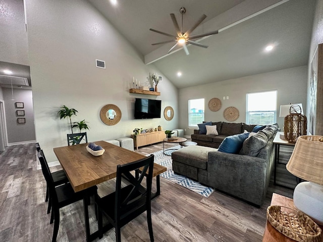 living room featuring hardwood / wood-style flooring, ceiling fan, high vaulted ceiling, and beamed ceiling