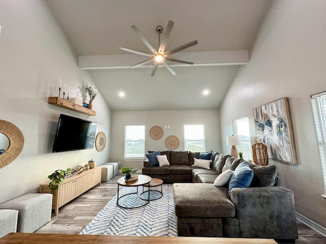 living room with lofted ceiling with beams, ceiling fan, and light wood-type flooring