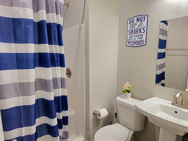 bathroom with sink and toilet