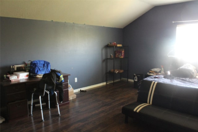 bedroom featuring lofted ceiling and dark wood-type flooring