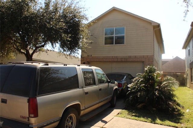 view of property exterior with a garage