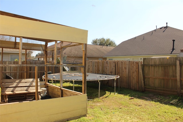 view of yard with a trampoline