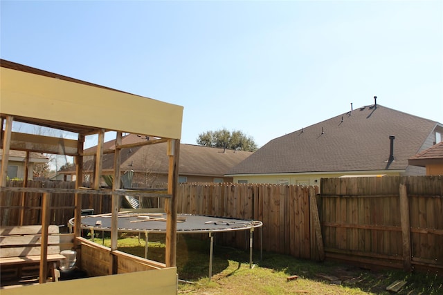 view of yard with a trampoline