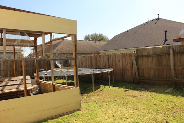 view of yard with a trampoline