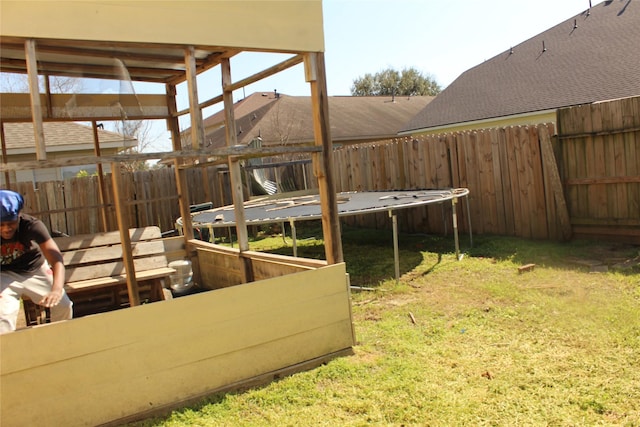 view of yard featuring a trampoline