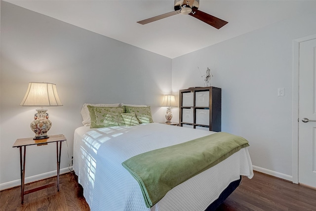 bedroom featuring ceiling fan and dark hardwood / wood-style floors