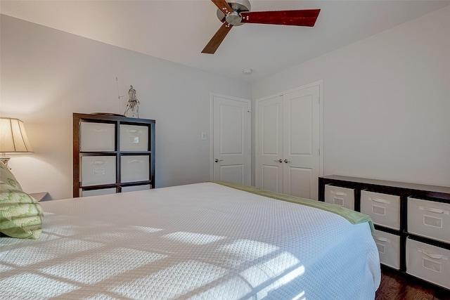 bedroom with ceiling fan and a closet