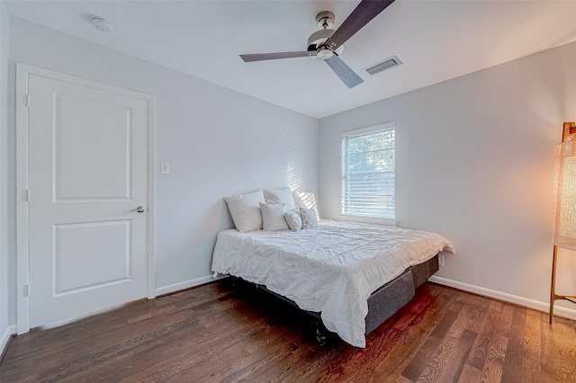 bedroom featuring dark hardwood / wood-style flooring and ceiling fan