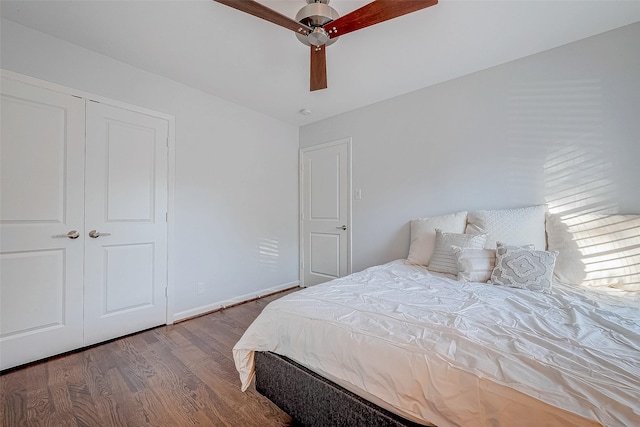 bedroom featuring ceiling fan, hardwood / wood-style floors, and a closet