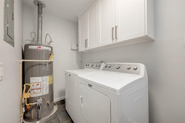 washroom featuring washer and dryer, cabinets, electric panel, and water heater