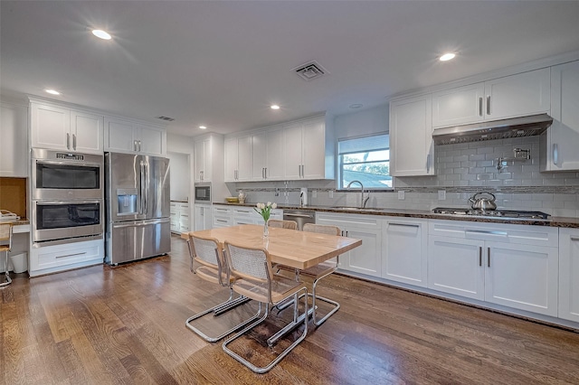 kitchen featuring white cabinetry, sink, and stainless steel appliances