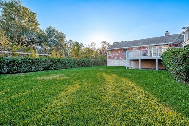 view of yard with a deck