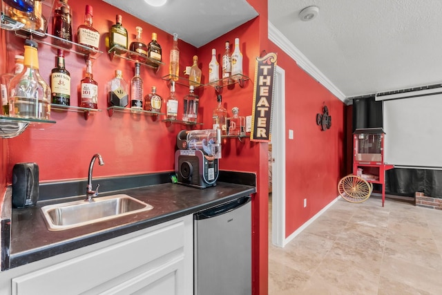 bar with a sink, baseboards, dishwashing machine, indoor wet bar, and ornamental molding