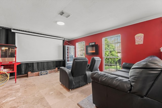 cinema with crown molding and visible vents