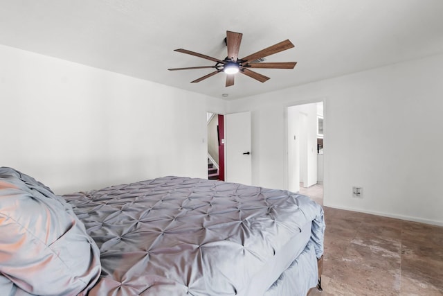 bedroom featuring baseboards and ceiling fan