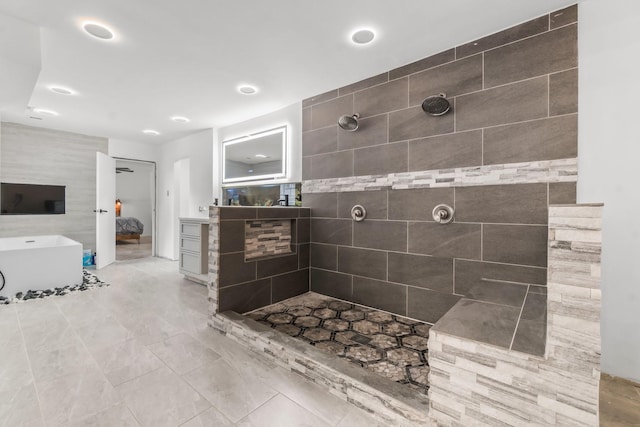 bathroom featuring recessed lighting, a freestanding tub, tiled shower, and connected bathroom