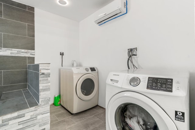 laundry room with independent washer and dryer, laundry area, and a wall mounted air conditioner