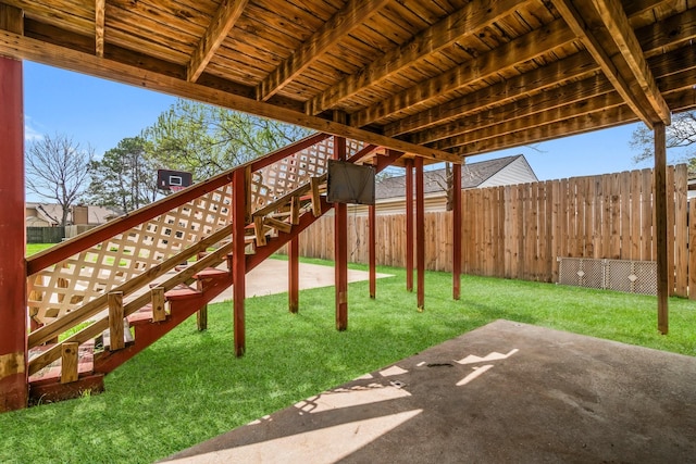 exterior space featuring a fenced backyard and stairway