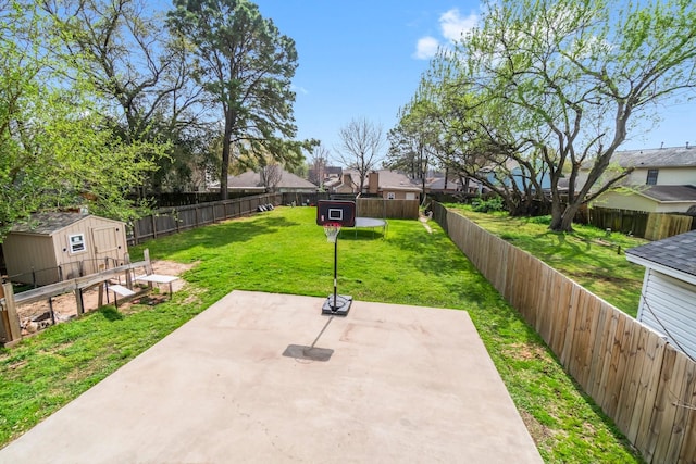 exterior space featuring a residential view, an outbuilding, and a fenced backyard